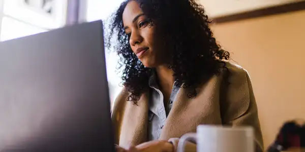 woman looking at laptop